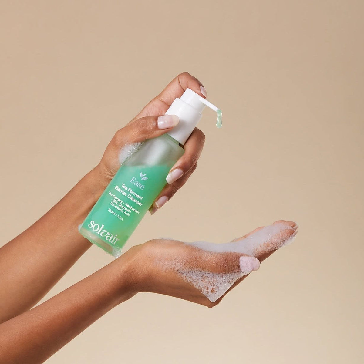 Dispensing EASE cleanser into wet hands