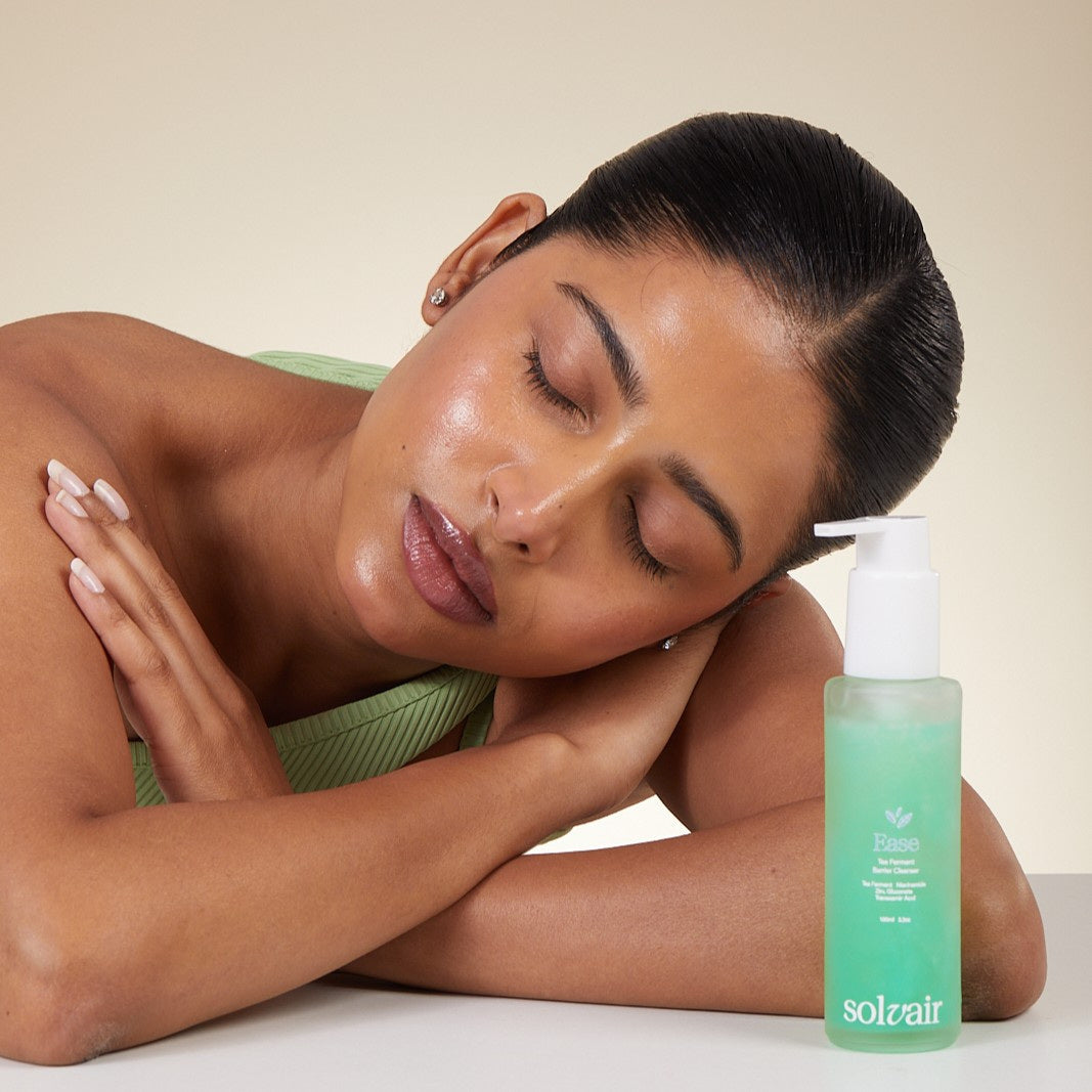 A model resting beside EASE cleanser