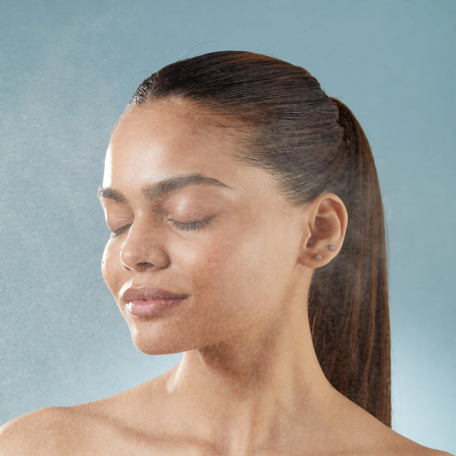 A model with eyes closed after a skincare ritual